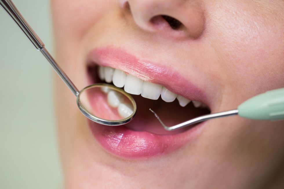 Dentist discussing cosmetic dental treatment with a patient